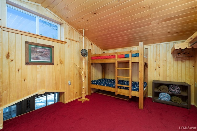 3159 N State Highway M94, Manistique, MI 49854 - carpeted bedroom with vaulted ceiling, wood walls, and wooden ceiling