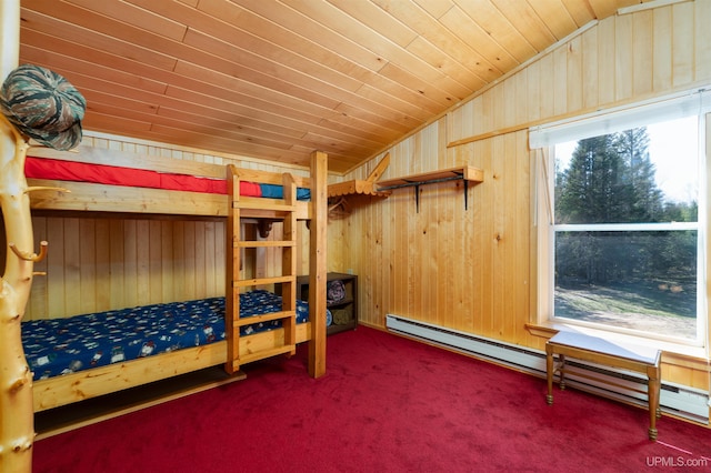 3159 N State Highway M94, Manistique, MI 49854 - carpeted bedroom with lofted ceiling, a baseboard radiator, wooden ceiling, and wooden walls
