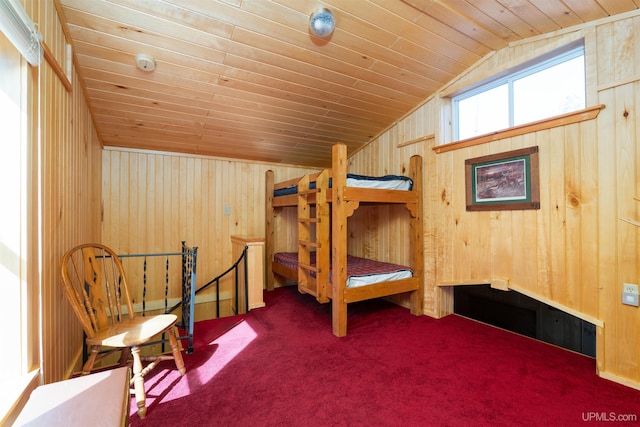 3159 N State Highway M94, Manistique, MI 49854 - carpeted bedroom with lofted ceiling, wood walls, and wood ceiling
