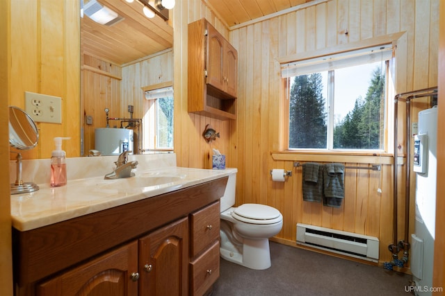 3159 N State Highway M94, Manistique, MI 49854 - bathroom featuring a baseboard heating unit, wooden ceiling, wood walls, vanity, and toilet