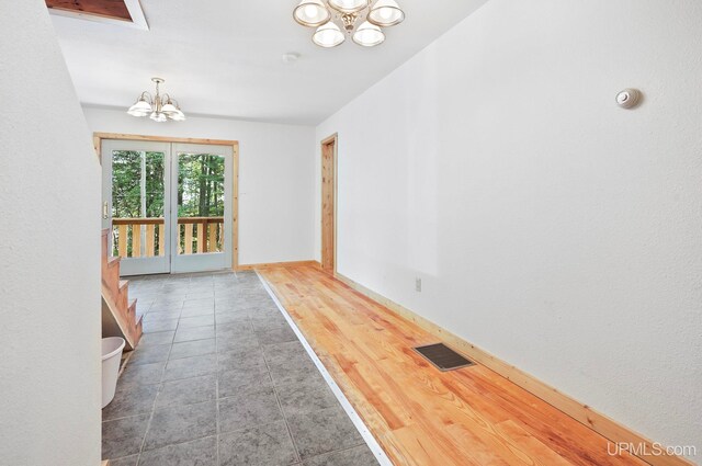 8413 Gay Park Rd, Lake Linden, MI 49945 - corridor with a chandelier and baseboards