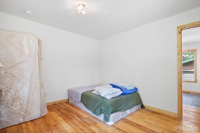 8413 Gay Park Rd, Lake Linden, MI 49945 - bedroom with baseboards and wood finished floors
