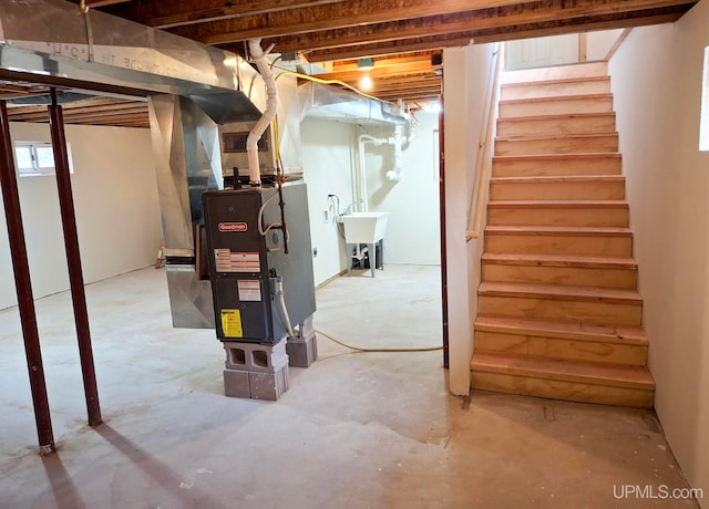 8413 Gay Park Rd, Lake Linden, MI 49945 - unfinished basement featuring stairs, a sink, and heating unit