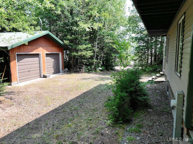 8413 Gay Park Rd, Lake Linden, MI 49945 - view of yard featuring an outdoor structure and a garage