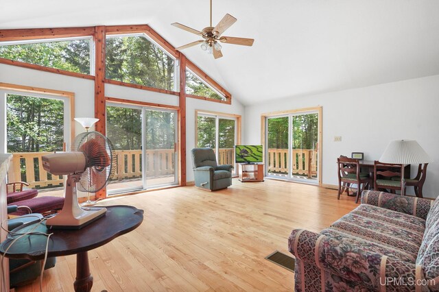 8413 Gay Park Rd, Lake Linden, MI 49945 - living area featuring high vaulted ceiling, ceiling fan, and wood finished floors