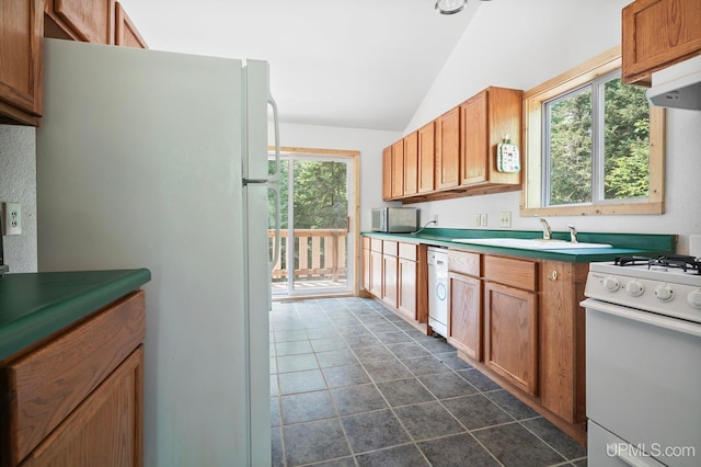 8413 Gay Park Rd, Lake Linden, MI 49945 - kitchen with a sink, white appliances, lofted ceiling, under cabinet range hood, and brown cabinetry