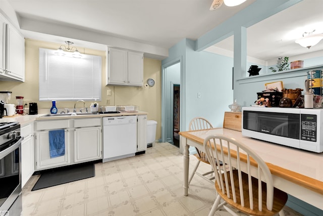 3582 David K Dr, Waterford, MI 48329 - kitchen featuring white appliances, a sink, light floors, light countertops, and white cabinetry