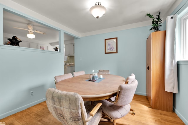 3582 David K Dr, Waterford, MI 48329 - dining area featuring light wood-style flooring and baseboards
