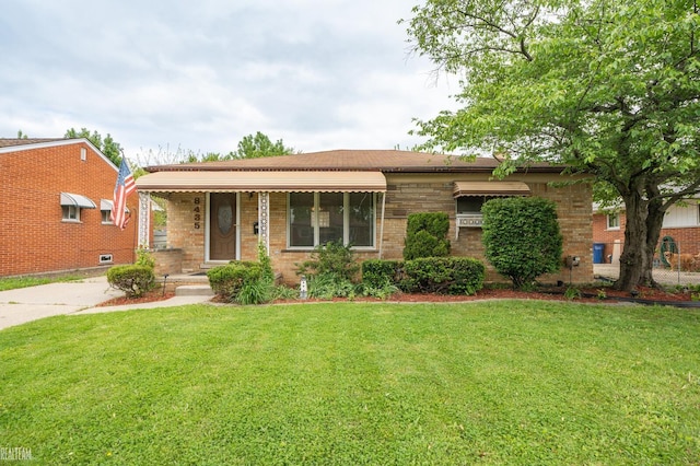 8435 Francine St, Warren, MI 48093 - view of front facade with a front lawn and brick siding