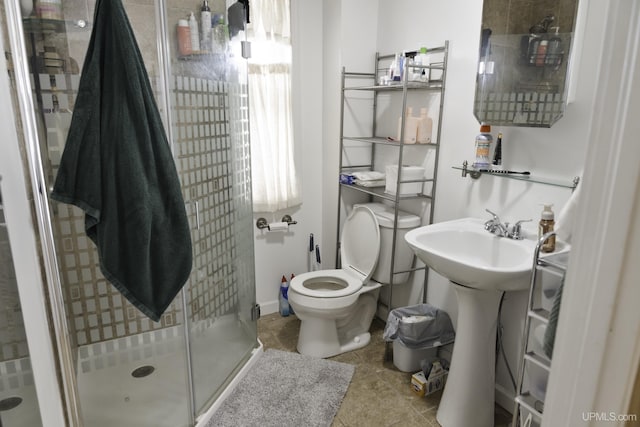 120 E Prospect St, Marquette, MI 49855 - full bath with a shower stall, tile patterned flooring, and toilet