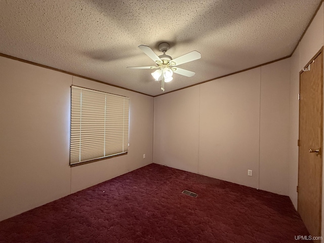20 Kenneally Blvd St, Gladstone, MI 49837 - carpeted spare room featuring a ceiling fan, ornamental molding, and a textured ceiling