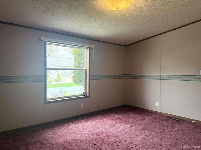 20 Kenneally Blvd St, Gladstone, MI 49837 - spare room with a textured ceiling, carpet flooring, and ornamental molding