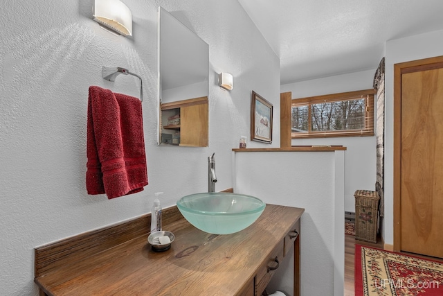 3172 Harry Patterson Dr, Phelps, WI 54554 - bathroom with vanity and a textured wall