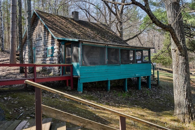 3172 Harry Patterson Dr, Phelps, WI 54554 - view of outdoor structure featuring a sunroom