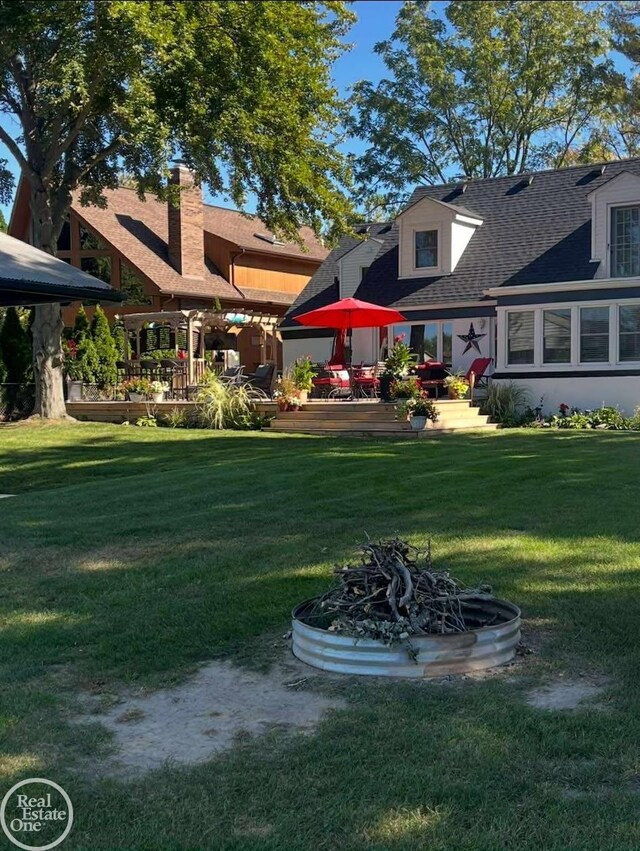 28800 Old N River Rd, Harrison Twp, MI 48045 - back of house featuring a shingled roof and a yard