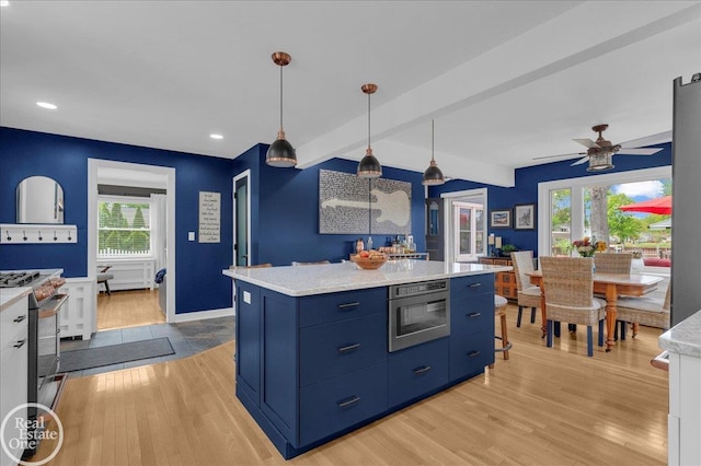 28800 Old N River Rd, Harrison Twp, MI 48045 - kitchen featuring blue cabinets, stainless steel appliances, light wood finished floors, light countertops, and ceiling fan