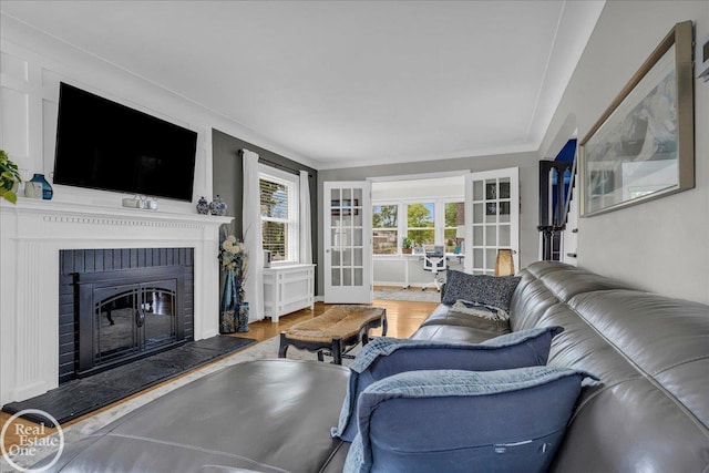 28800 Old N River Rd, Harrison Twp, MI 48045 - living room with wood finished floors, french doors, and a brick fireplace
