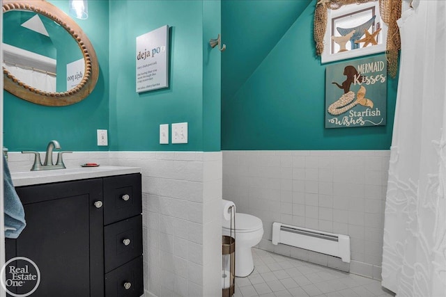 28800 Old N River Rd, Harrison Twp, MI 48045 - full bathroom with baseboard heating, tile walls, toilet, vanity, and wainscoting
