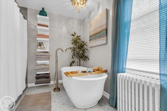 28800 Old N River Rd, Harrison Twp, MI 48045 - full bath featuring radiator, a freestanding bath, and baseboards