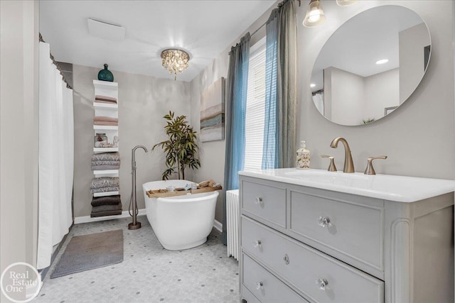 28800 Old N River Rd, Harrison Twp, MI 48045 - full bathroom featuring vanity, baseboards, a freestanding bath, and healthy amount of natural light