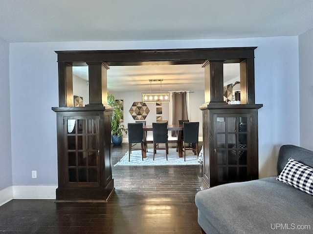 1217 S Kimberly Ave, Iron Mountain, MI 49801 - living room with baseboards and wood finished floors