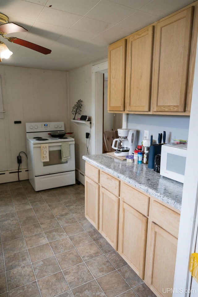 3110 County Road Fd Rd, Champion, MI 49814 - kitchen with white appliances, light brown cabinets, a ceiling fan, baseboard heating, and a baseboard heating unit