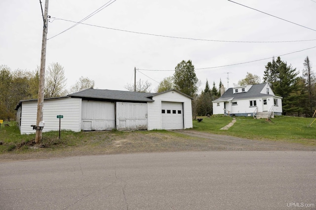 3110 County Road Fd Rd, Champion, MI 49814 - detached garage with dirt driveway