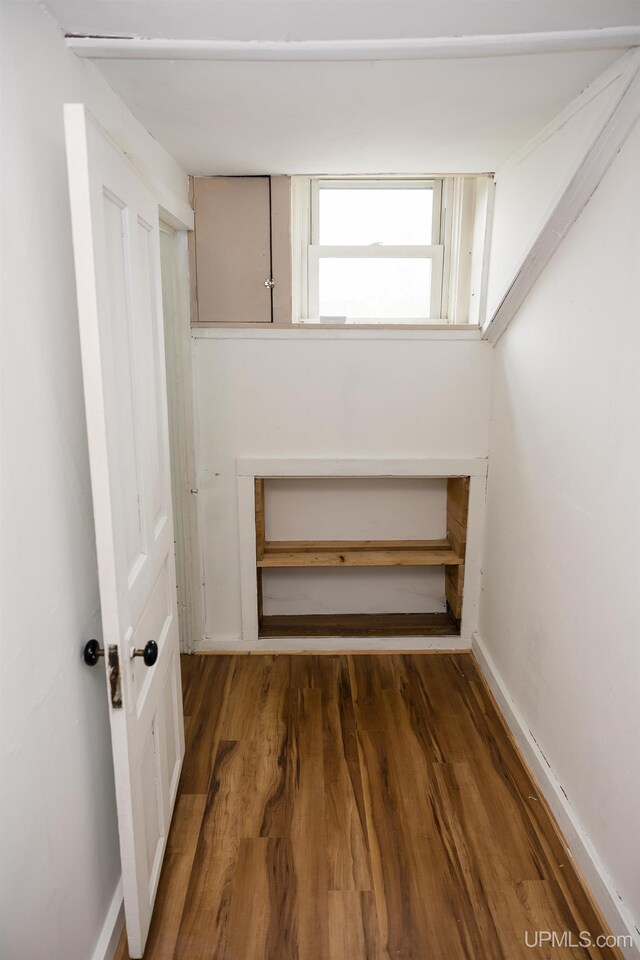 3110 County Road Fd Rd, Champion, MI 49814 - below grade area featuring wood finished floors and baseboards