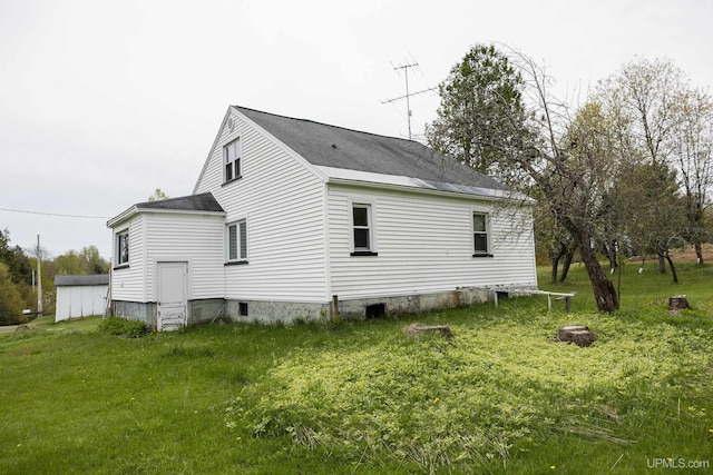 3110 County Road Fd Rd, Champion, MI 49814 - view of side of property with roof with shingles and a yard