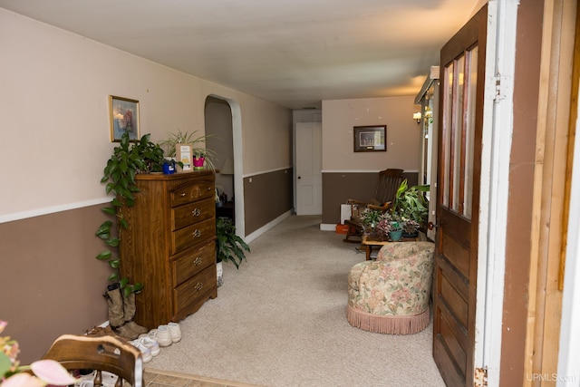 3110 County Road Fd Rd, Champion, MI 49814 - living area featuring light carpet, arched walkways, and baseboards