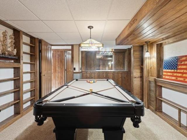 5631 W Spring Knoll Dr, Bay City, MI 48706 - recreation room with light carpet, wood walls, and pool table