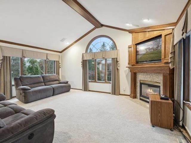 5631 W Spring Knoll Dr, Bay City, MI 48706 - living room with a high end fireplace, lofted ceiling, carpet floors, and baseboards