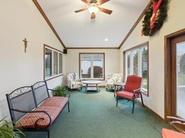 5631 W Spring Knoll Dr, Bay City, MI 48706 - sunroom / solarium with lofted ceiling, carpet floors, and crown molding