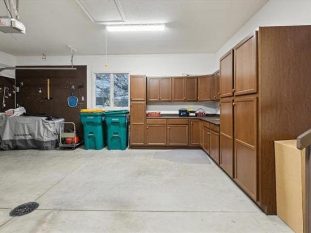 5631 W Spring Knoll Dr, Bay City, MI 48706 - garage featuring a garage door opener
