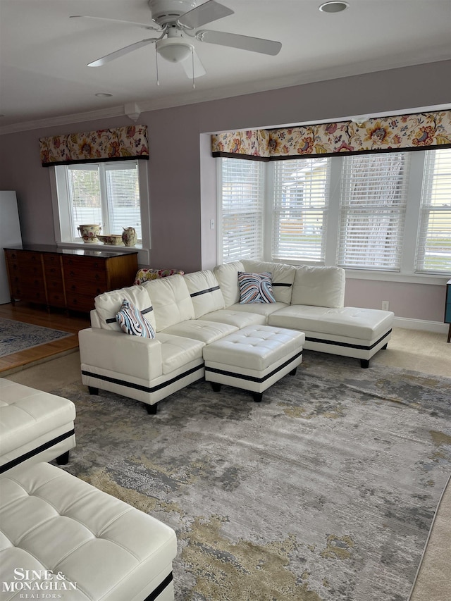 2740 River Rd, Marysville, MI 48040 - carpeted living area with ornamental molding and a ceiling fan