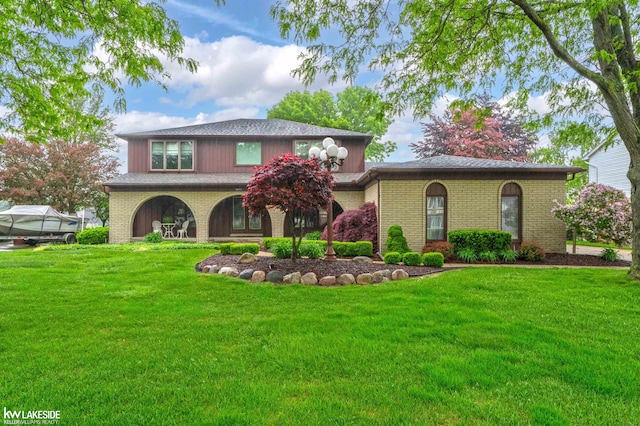 46713 Houghton Dr, Shelby Twp, MI 48315 - view of front of home featuring a front yard and brick siding