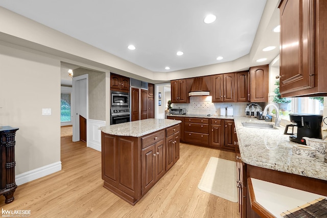 46713 Houghton Dr, Shelby Twp, MI 48315 - kitchen with a sink, stainless steel appliances, light wood-style floors, a center island, and recessed lighting