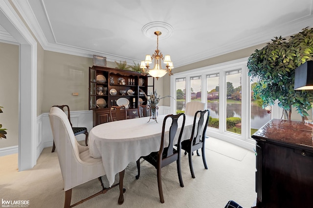 46713 Houghton Dr, Shelby Twp, MI 48315 - dining room with light carpet, a chandelier, ornamental molding, and wainscoting