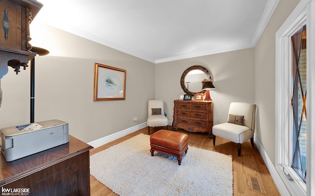 46713 Houghton Dr, Shelby Twp, MI 48315 - living area featuring light wood finished floors, ornamental molding, and baseboards