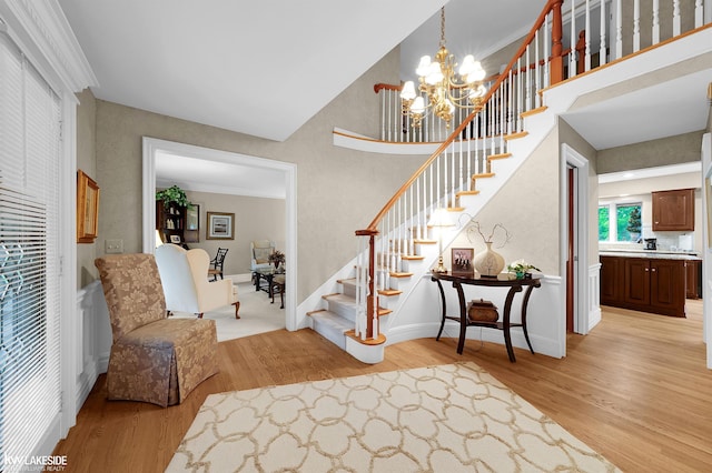 46713 Houghton Dr, Shelby Twp, MI 48315 - entrance foyer featuring light wood-type flooring, stairs, a chandelier, a heating unit, and baseboards