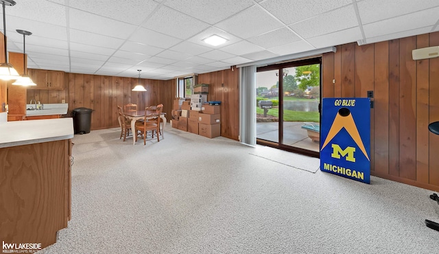 46713 Houghton Dr, Shelby Twp, MI 48315 - dining room with wood walls, healthy amount of natural light, and a paneled ceiling