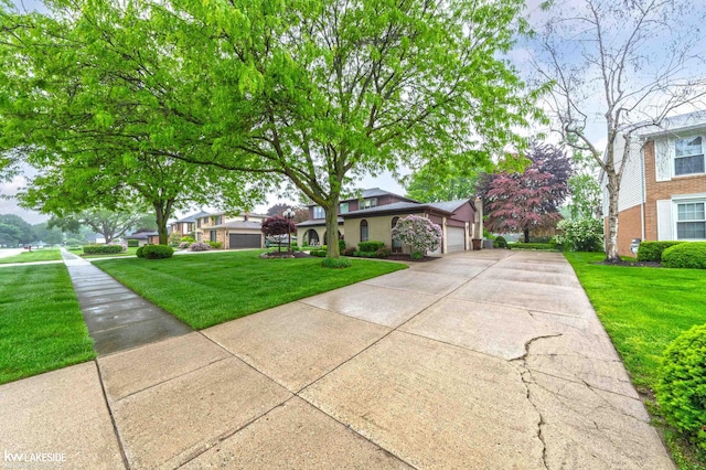 46713 Houghton Dr, Shelby Twp, MI 48315 - view of front facade with an attached garage, a front lawn, and driveway