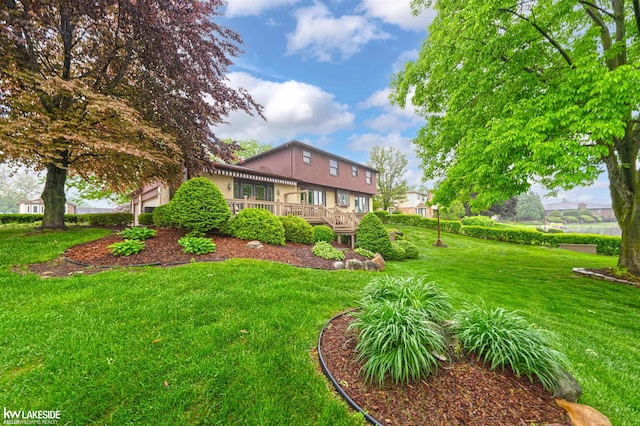 46713 Houghton Dr, Shelby Twp, MI 48315 - view of green lawn with a wooden deck