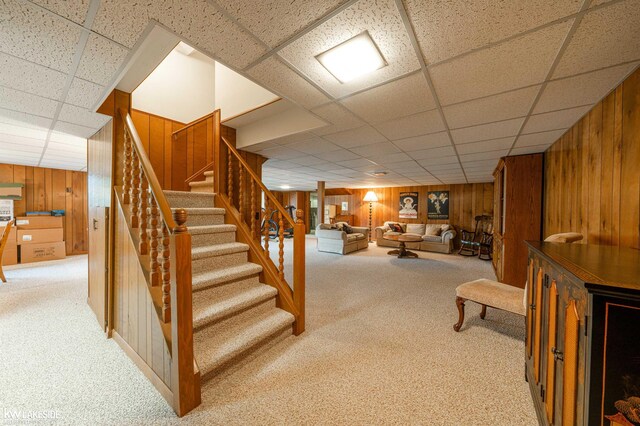 46713 Houghton Dr, Shelby Twp, MI 48315 - staircase with wood walls, carpet, and a paneled ceiling