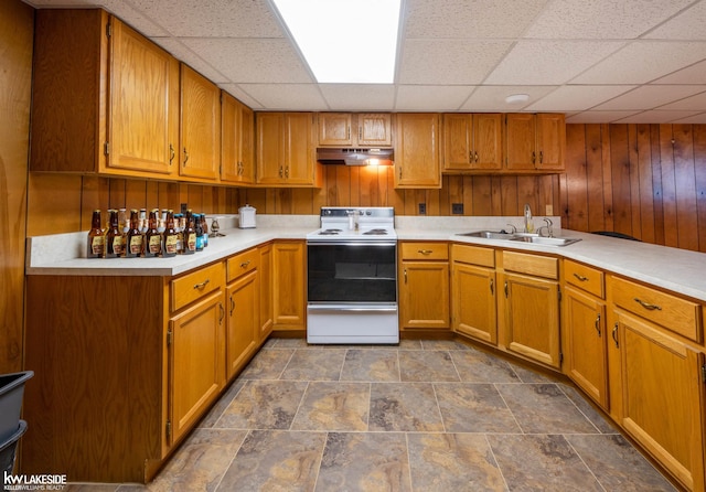 46713 Houghton Dr, Shelby Twp, MI 48315 - kitchen featuring white electric range, a sink, a drop ceiling, under cabinet range hood, and light countertops