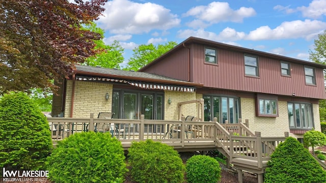 46713 Houghton Dr, Shelby Twp, MI 48315 - rear view of house with brick siding and a wooden deck