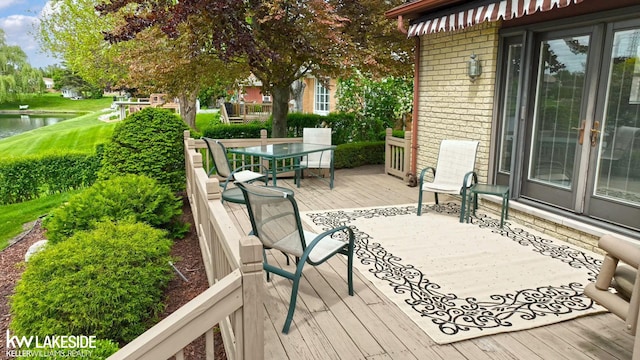 46713 Houghton Dr, Shelby Twp, MI 48315 - wooden terrace featuring a water view and outdoor dining area