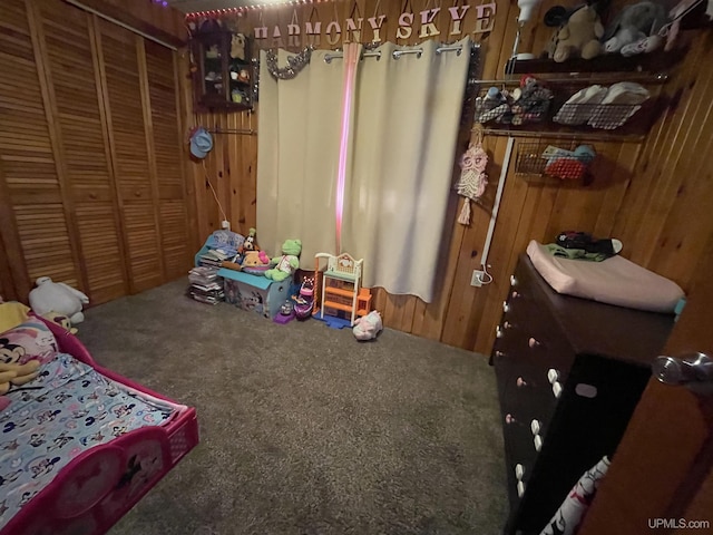 1110 N 2nd St, Ishpeming, MI 49849 - bedroom featuring carpet flooring, wooden walls, and a closet