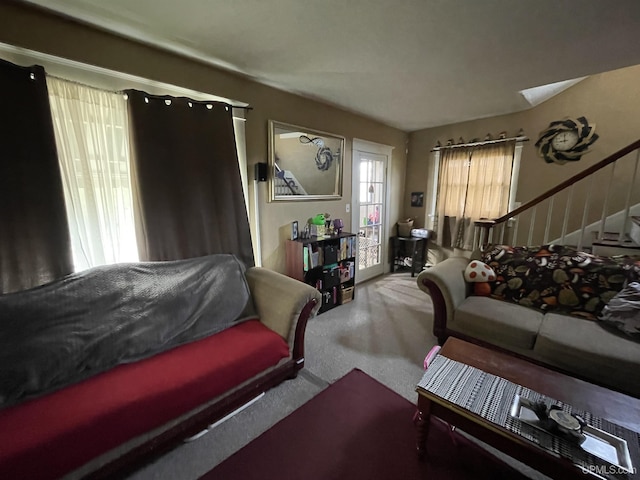 1110 N 2nd St, Ishpeming, MI 49849 - carpeted living room featuring stairs