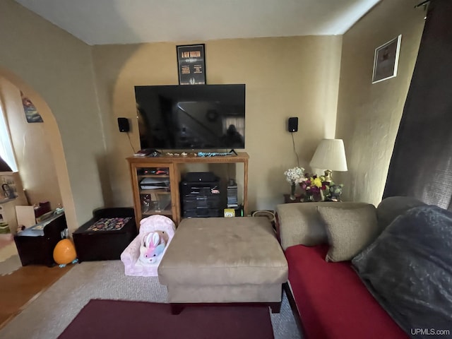 1110 N 2nd St, Ishpeming, MI 49849 - carpeted living room featuring arched walkways